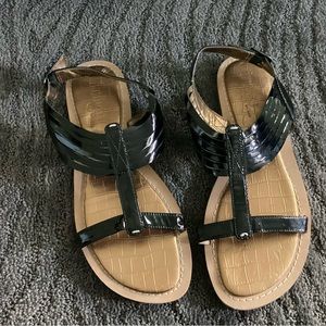 Indigo by Clark’s black patent flat sandals.